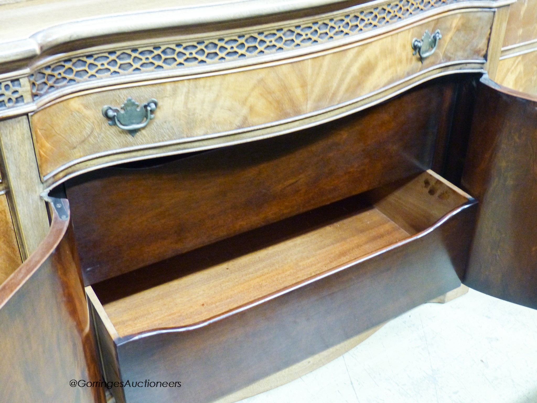 A Georgian style mahogany serpentine front library bookcase, width 160cm, depth 50cm, height 198cm